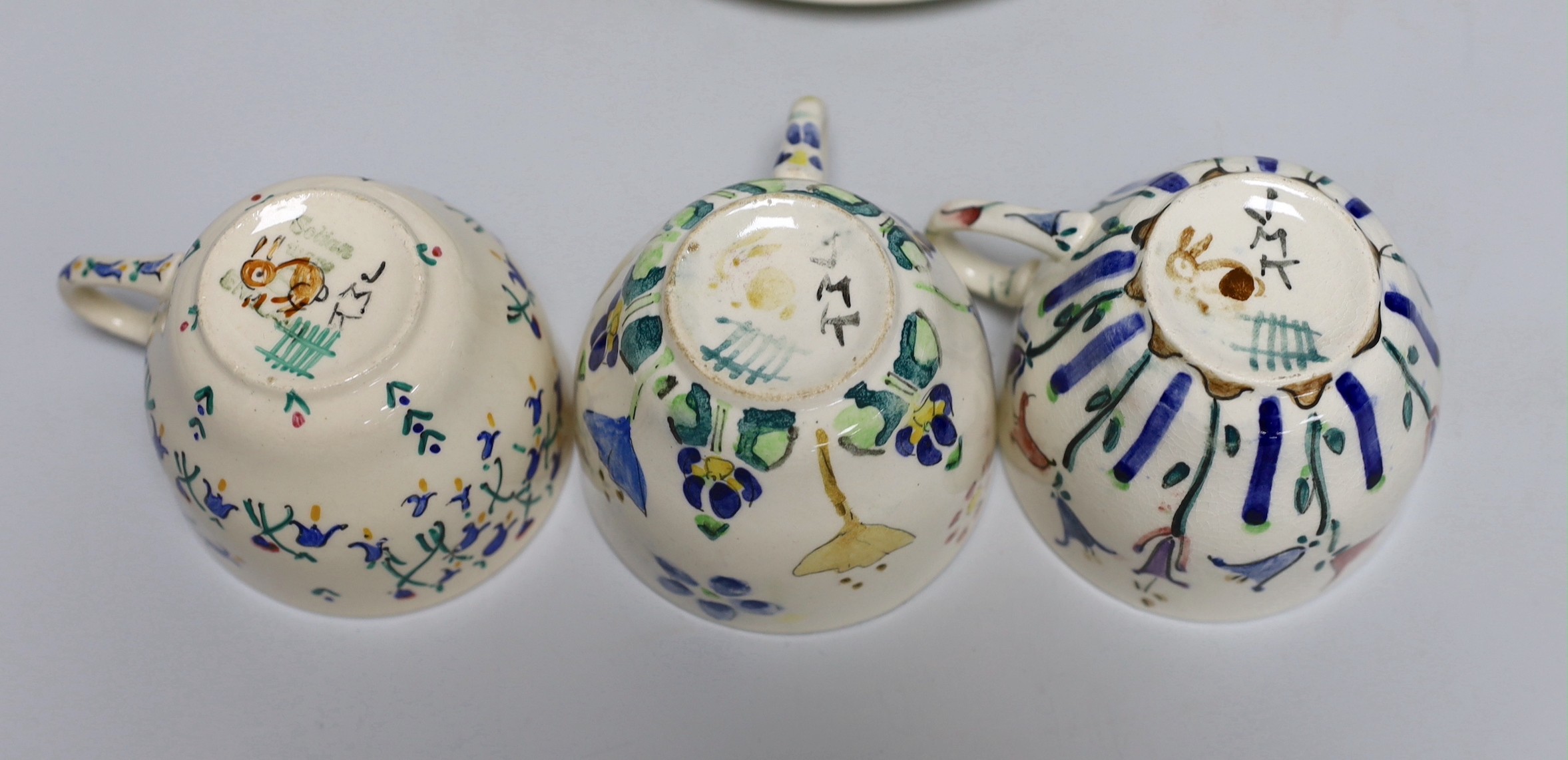 Jessie Marion King (1875-1949), four various floral design tea plates and three tea cups